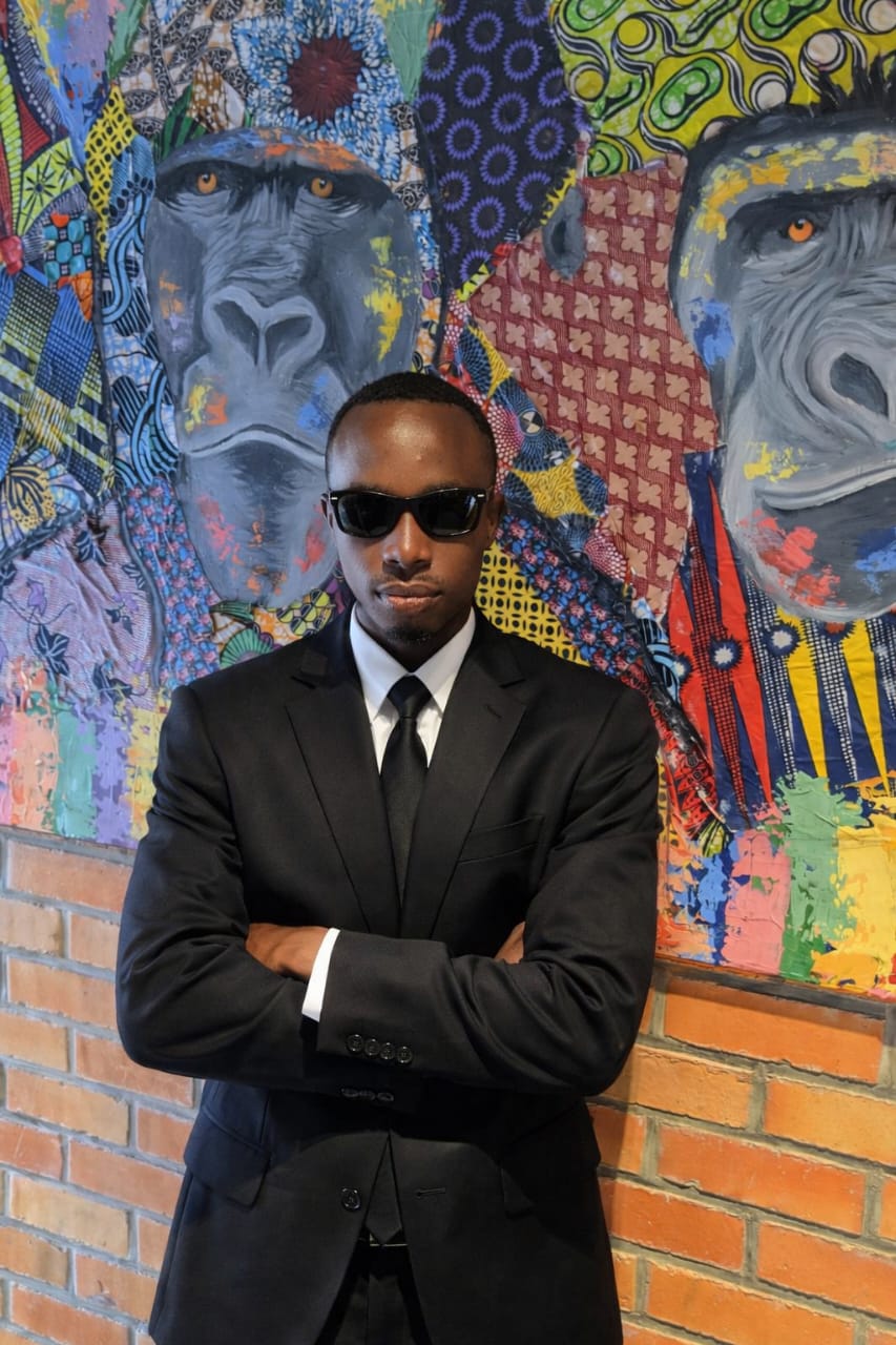 ISHIMWE Fabrice, wearing a dark suit